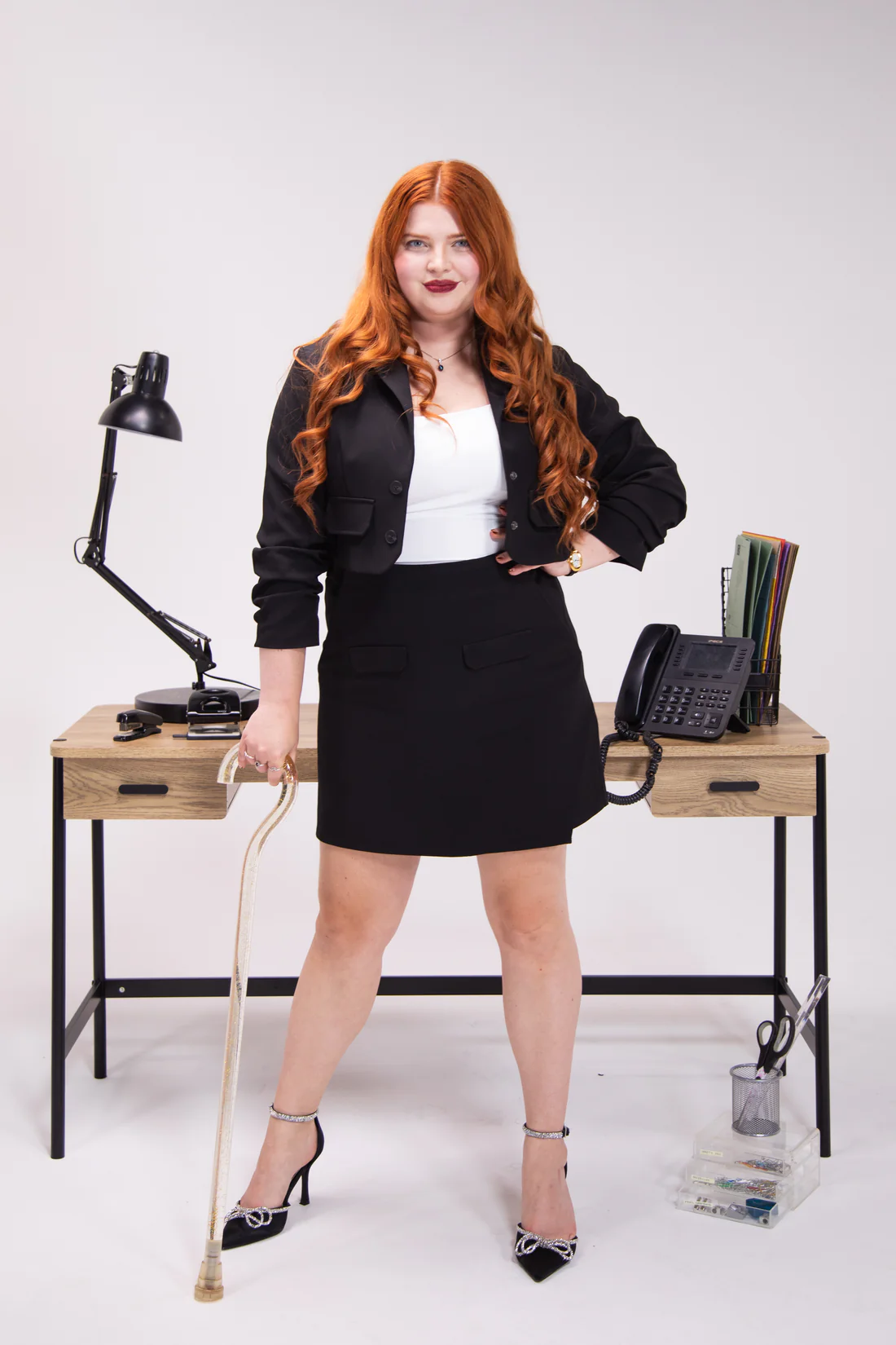 Women wears short skirt suit in black